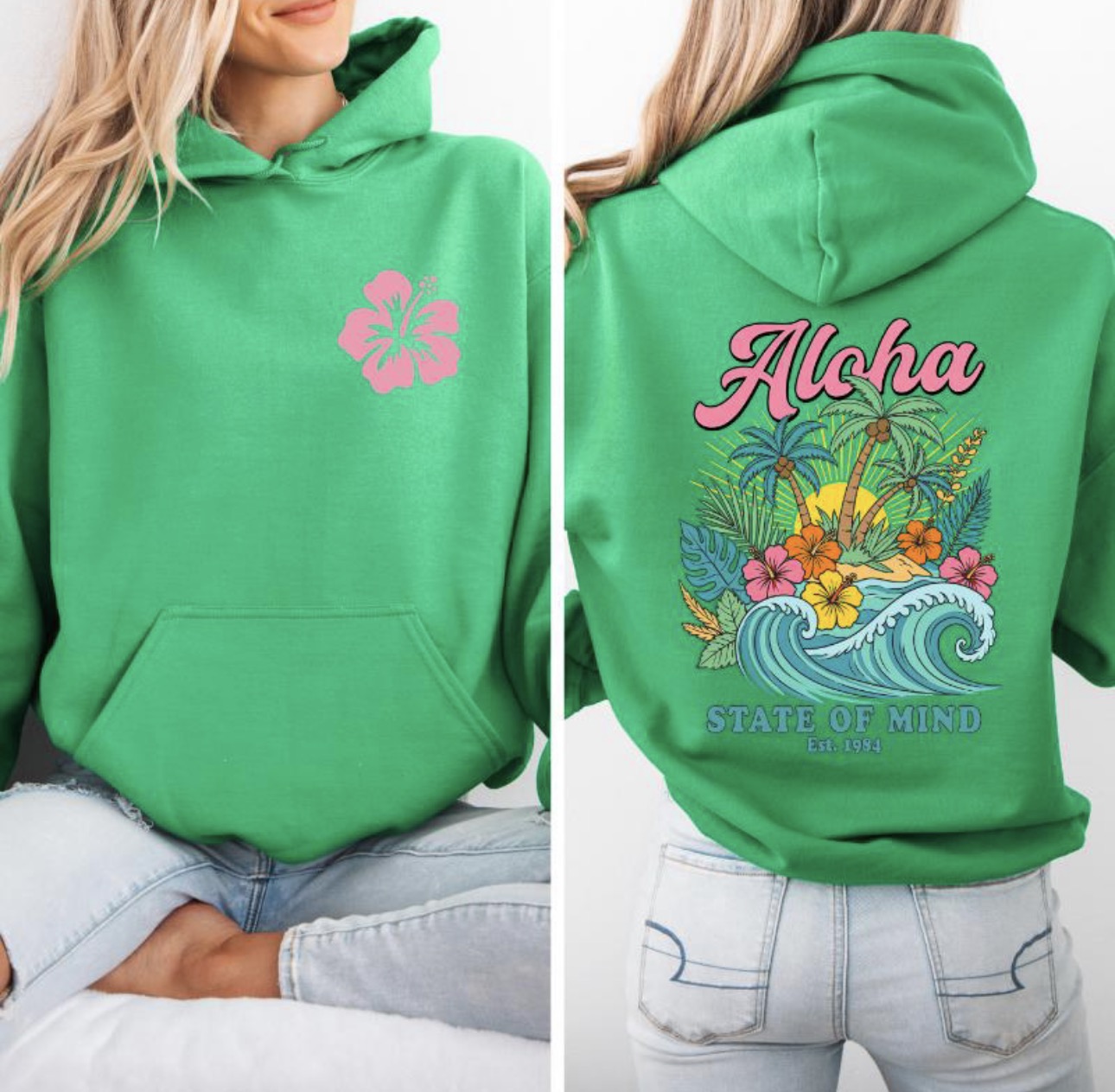 Green hoodie with pink flower design on front and tropical-themed design on back, worn by a person.